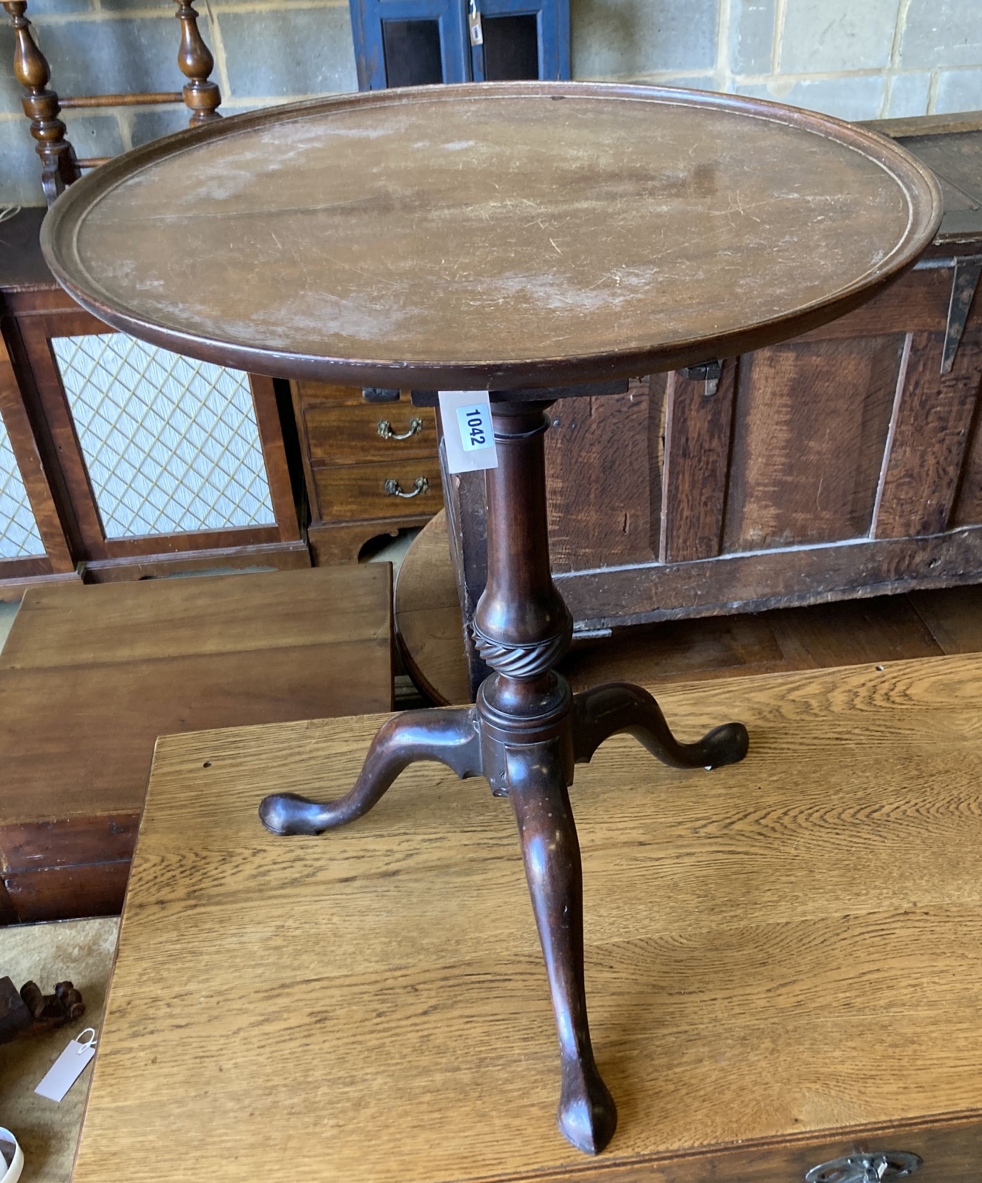 A George III mahogany birdcage tilt top tripod table, diameter 62cm, height 72cm